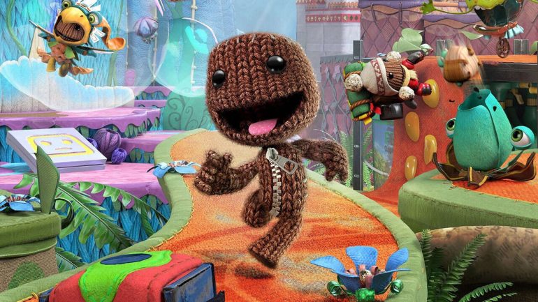 Sackboy running on a colorful path.